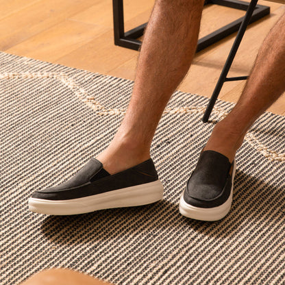 Pacific slip-on shoes in black facing left and right, highlighting comfort and durable, beach-inspired design.