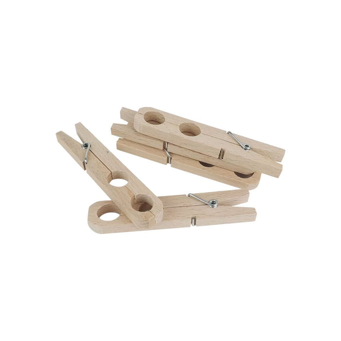 Set of wooden plant clamps on white background