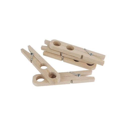 Set of wooden plant clamps on white background