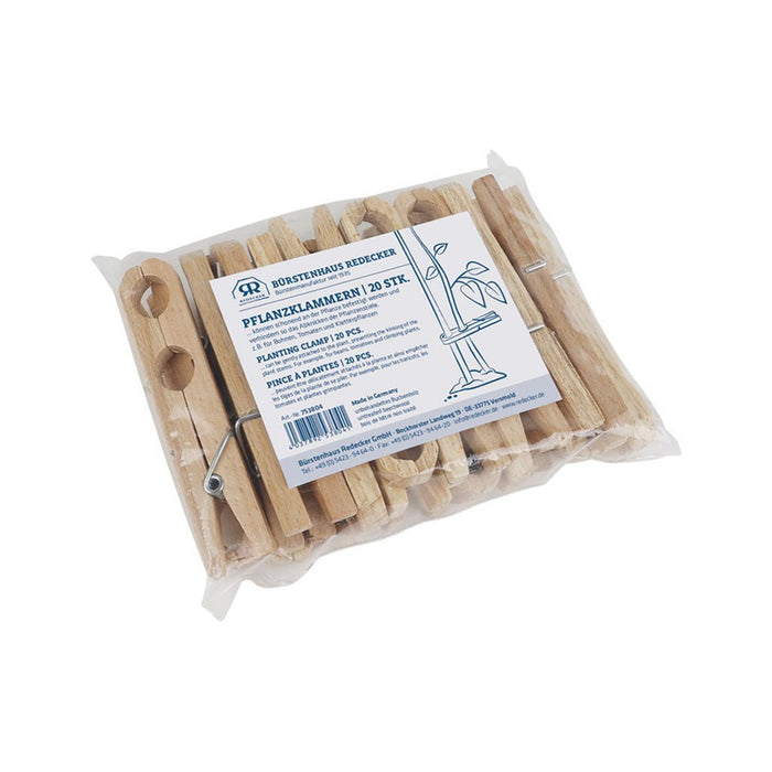 Pack of wooden plant clips in packaging on white background