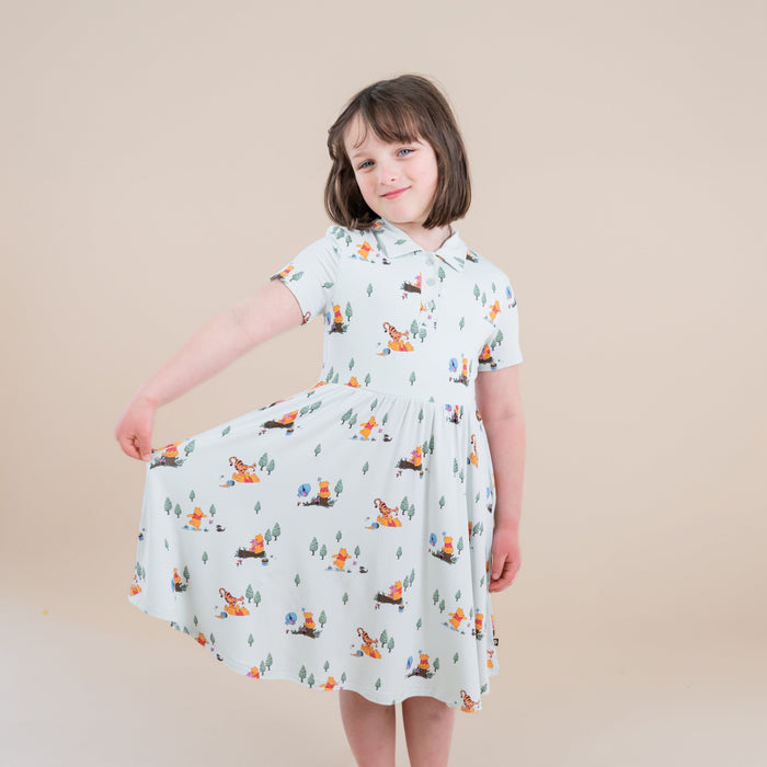 Young girl modeling the Polo Dress in Winnie the Pooh Hundred Acre Wood