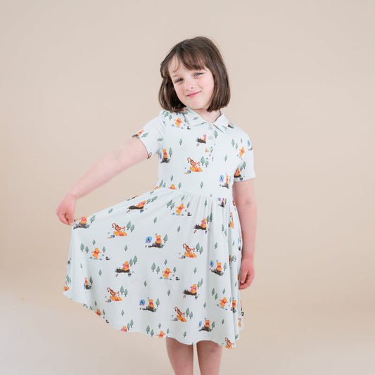 Young girl modeling the Polo Dress in Winnie the Pooh Hundred Acre Wood