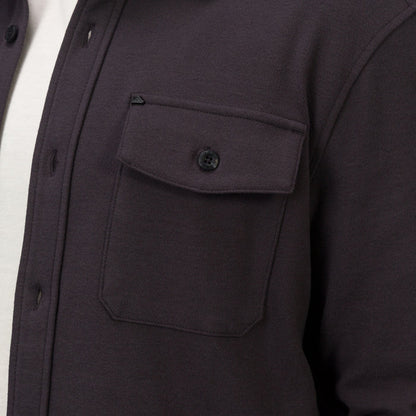 Close-up of the chest pocket and button flap on the Raymond Ls Shirt, showing soft, durable fabric and surf-inspired design.