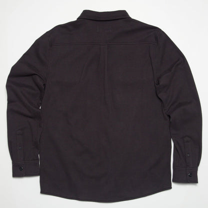 Raymond Ls Shirt showing back view in dark color, surf-inspired comfort apparel designed for beach and active lifestyles.