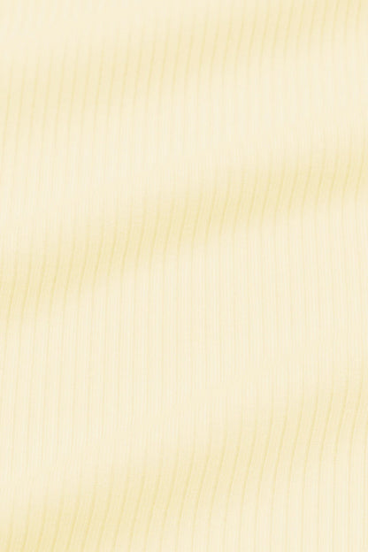 Close up of the ribbed fabric: A muted pastel yellow