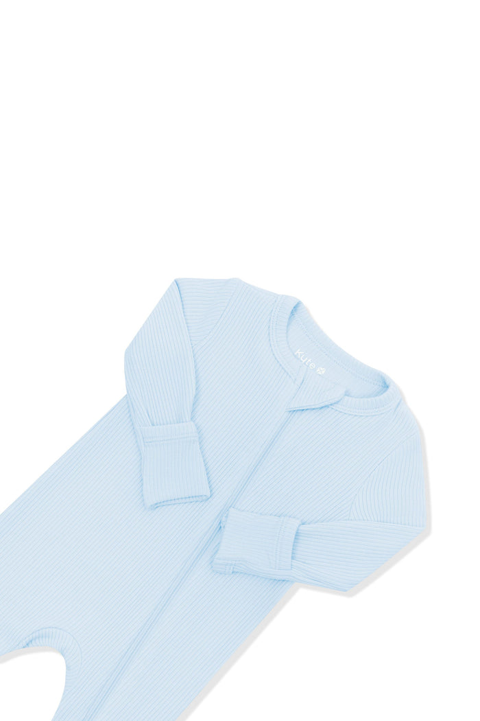 Close up of the zipper garage and fold over hand cuffs on the Ribbed Zipper Romper in Breeze