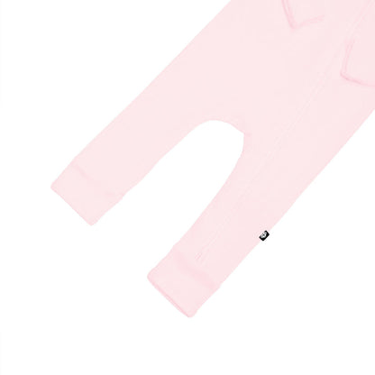 Open feet on Kyte Baby Ribbed Zippered Romper in Sakura