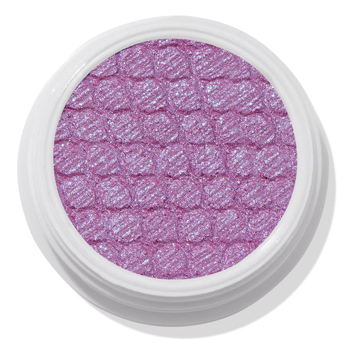 ColourPop Ripple Super Shock Shadow, a shimmering lavender eyeshadow with blue-violet sparkle, fills a textured quilted pan in a round white pot, shown top-down on a clean white background.
