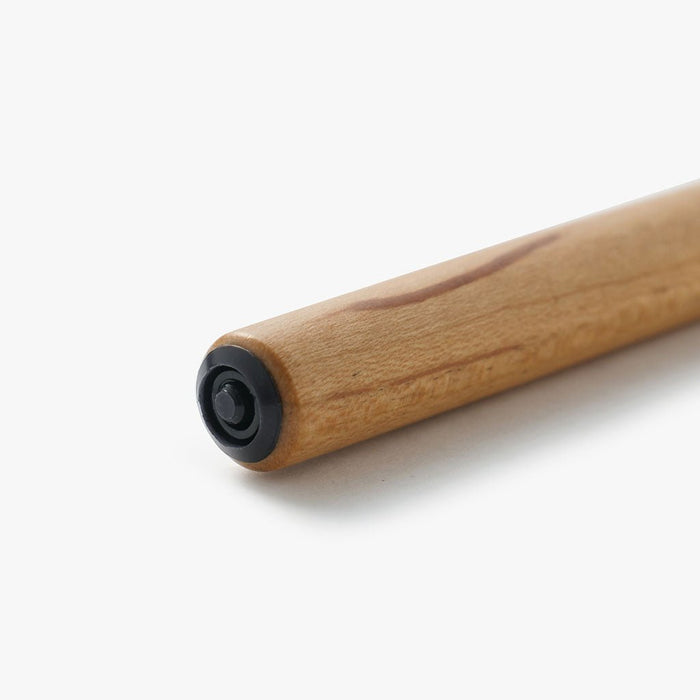 Close up of sakura wood nib holder on white surface