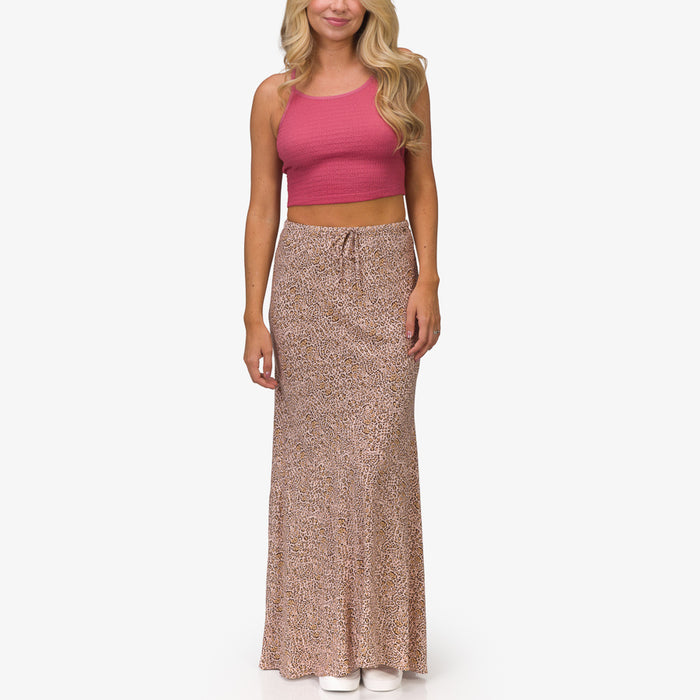 Woman wearing a Sandy Maxi Skirt with a rose animal print, front view, styled for beach and everyday comfort.