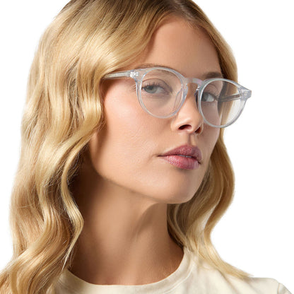 on model - female wearing diff eyewear sawyer round prescription glasses with a opalescent turquoise frame angled view