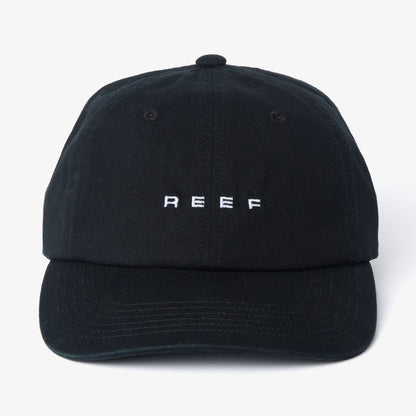 Front view of black Schotts Twill Hat with white REEF logo, featuring lightweight, durable, and comfortable beach-inspired design.