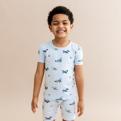 Smiling boy wearing the Short Sleeve Pajamas in Take Off