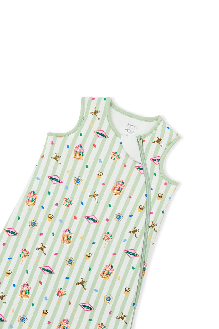Zipper of green and white striped sleep bag with colorful Harry Potter patterns on a white background