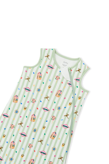 Zipper of green and white striped sleep bag with colorful Harry Potter patterns on a white background
