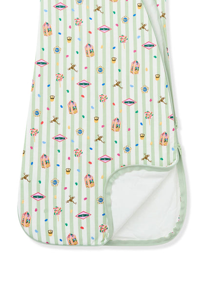 Bottom part of the sleep bag with colorful Harry Potter patterns on green and white striped fabric a white background