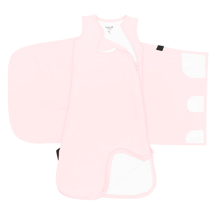 Zipper garage, double zipper and adjustable velcro swaddle wrap shown on an unswaddled Sleep Bag Swaddler in Sakura 1.0