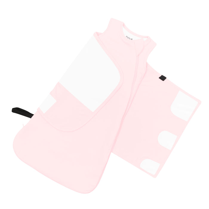 The adjustable velcro swaddle wrap shown on the Sleep Bag Swaddler in Sakura 1.0