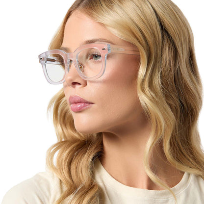 on model - female wearing diff eyewear featuring the summer square prescription glasses with a opalescent pink frame angled view
