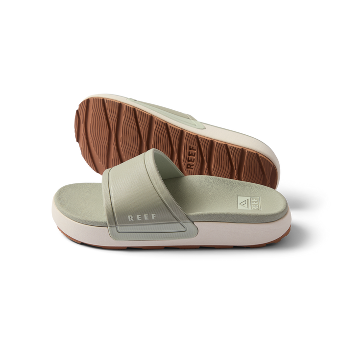 Pair of women's Sydnee Cutback Low slides in sage facing right, showing top and sole with textured brown outsole.