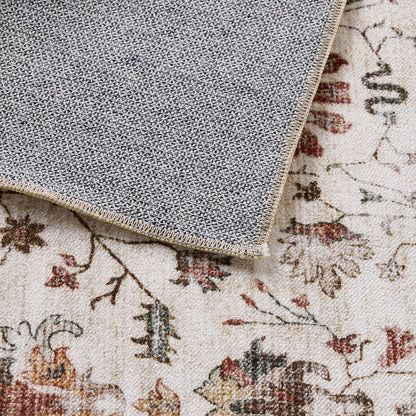A corner of the Tarot Nouveau Washable Runner 80x200cm is folded over, showing its textured non-slip backing and floral pattern on the front.