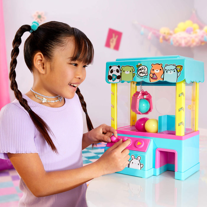 Girl playing with the Claw Machine