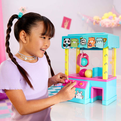 Girl playing with the Claw Machine