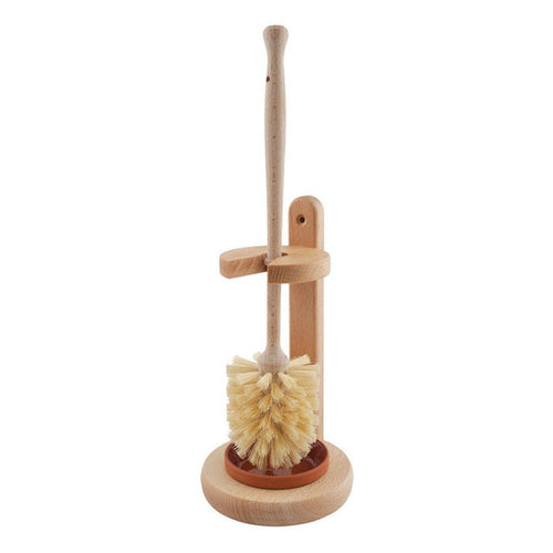 Wooden toilet brush with natural fibers in wooden stand with terracotta dish on white background