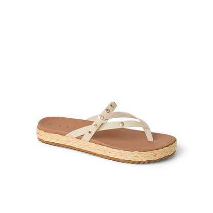Vista Carmen women's sandal facing right, beige straps with rivets, cushioned footbed and textured sole, beach-inspired comfort.