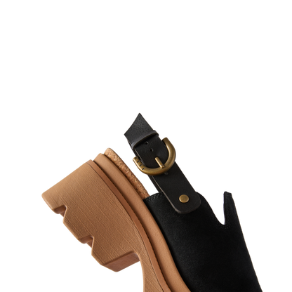 Close-up of the rear and sole of black Vista Luxe Solene sandal facing left, featuring comfort arch support and cushioned heel.