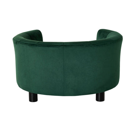 The Vivienne Velvet Pet Bed in Forest (65x65x36cm) features plush green upholstery, a curved backrest, and black cylindrical legs, displayed from the rear against a white background.