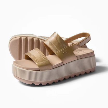 Water Vista Higher women's platform sandal facing left with cushioned sole, arch support, and water-friendly straps in metallic gold.