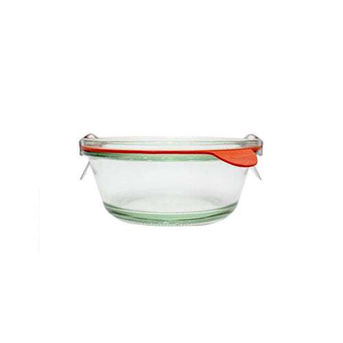 Clear glass Weck 750 bowl jar with glass lid and clamps on white background