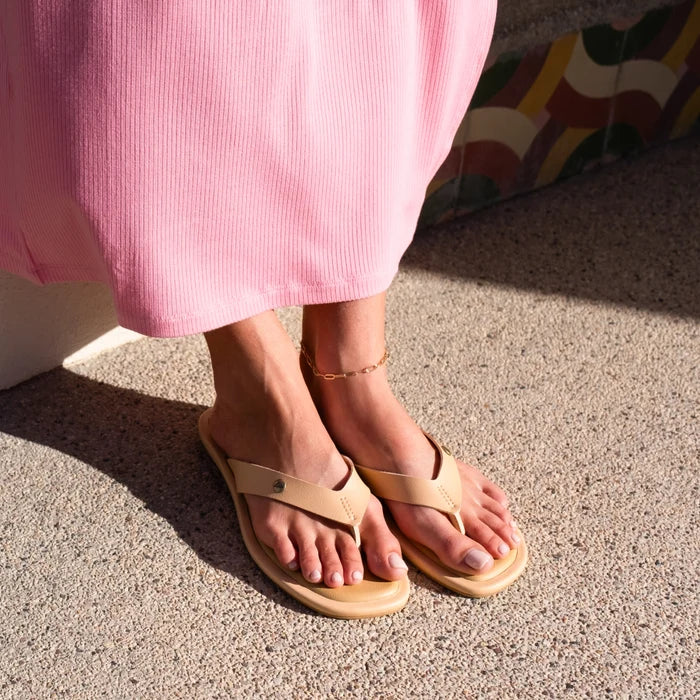 Willow Ella women's sandals facing forward, beige with molded footbed and soft-rebound cushioning, worn with pink dress