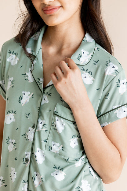 Model showcasing the collar of Women's Short Sleeve Pajama Set in Koala print on beige background