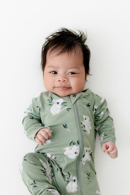 Close up of newborn wearing the Zippered Footie in Koala